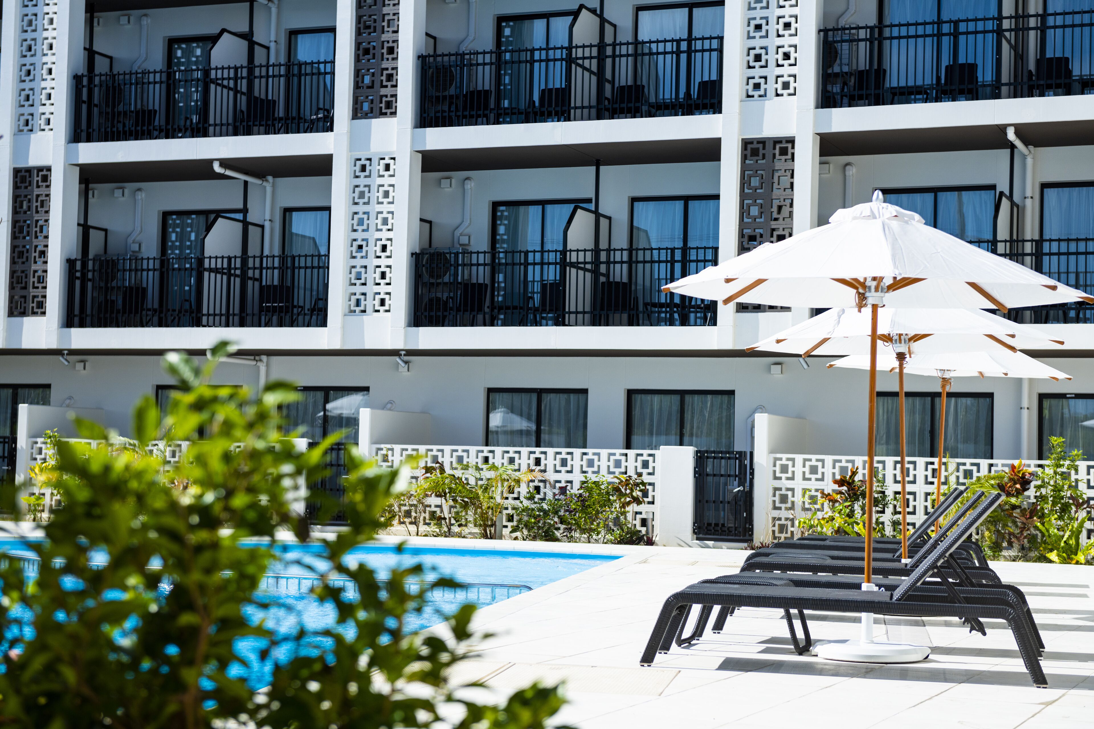 Outdoor pool, open 10:00 AM to 7:00 PM, pool umbrellas, pool loungers