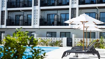 Outdoor pool, open 10:00 AM to 7:00 PM, pool umbrellas, pool loungers
