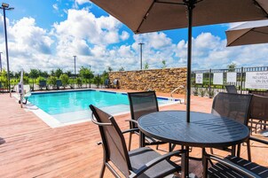 Outdoor pool, open 8:00 AM to 11:00 PM, pool umbrellas