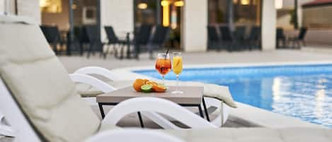 Seasonal outdoor pool, pool umbrellas, pool loungers