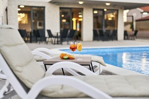 Seasonal outdoor pool, pool umbrellas, sun loungers