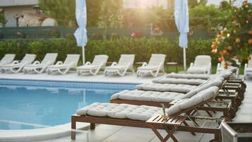 Seasonal outdoor pool, pool umbrellas, sun loungers