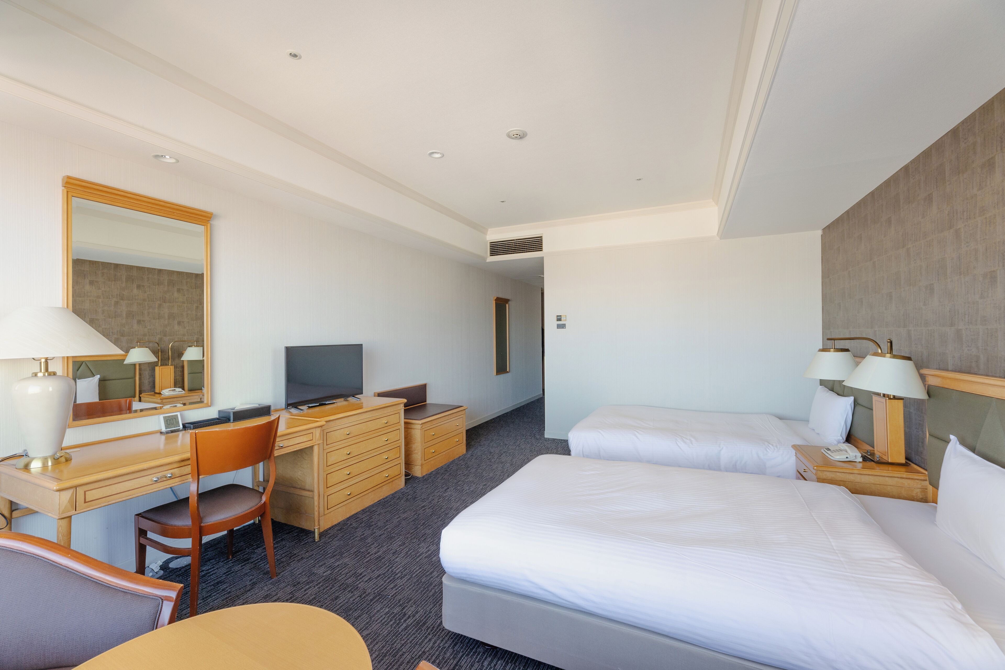 corner view deluxe twin, non smoking | desk, laptop workspace, blackout curtains, iron/ironing board