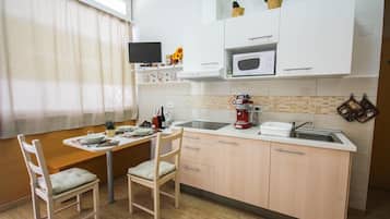 Classic Suite | Private kitchenette | Full-sized fridge, stovetop, coffee/tea maker, electric kettle