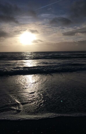 On the beach, sun-loungers