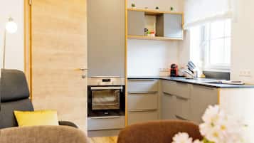 Apartment, 2 Bedrooms (Fuchsenloch) | Living area | 100-cm flat-screen TV with satellite channels, books, heated floors