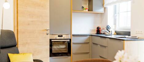 Apartment, 2 Bedrooms (Fuchsenloch) | Living area | 100-cm flat-screen TV with satellite channels, books, heated floors