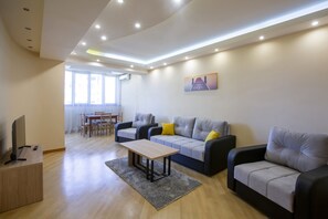 Panoramic Apartment, Balcony, Hill View | Living area | 41-inch flat-screen TV with digital channels, TV - Umba Apartment N4 (Yerevan)