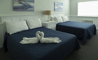 Cubrecamas, colchones con pillow-top y espacio para trabajar con laptop 