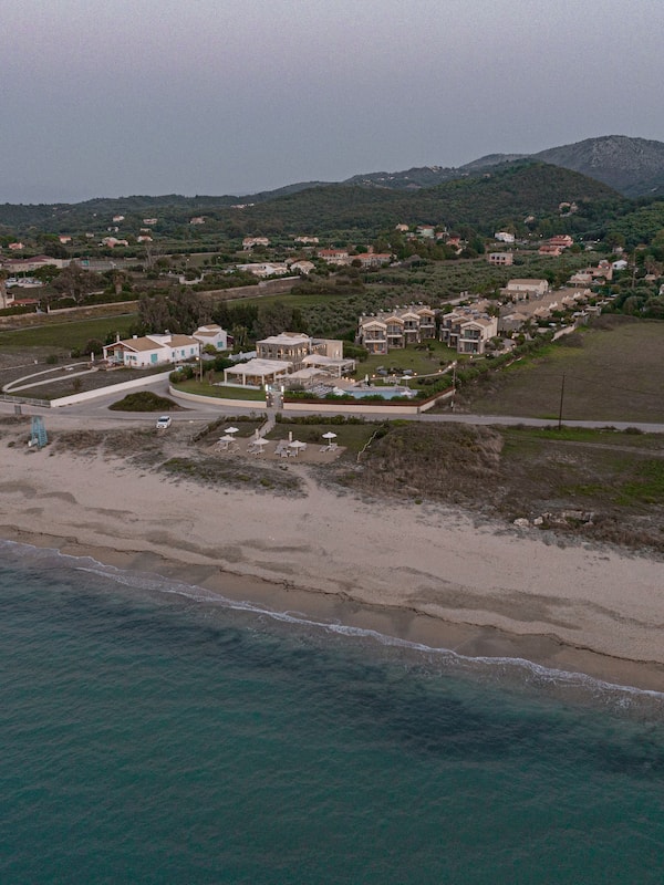 On the beach, sun-loungers, beach umbrellas, beach towels