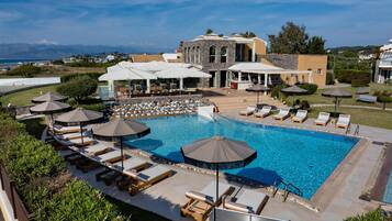 Seasonal outdoor pool, open 10:00 AM to 6:00 PM, pool umbrellas