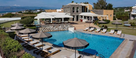 Seasonal outdoor pool, open 10:00 AM to 6:00 PM, pool umbrellas