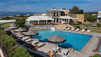 Seasonal outdoor pool, open 8:00 AM to 7:00 PM, pool umbrellas