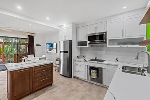 Fridge, microwave, oven, stovetop - Colorful & Private 2-Bedroom Condo Just a Short Walk from the Beach (Coco)