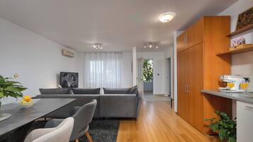 Deluxe Apartment, 1 King Bed with Sofa bed, Terrace, Sea View | Living area | TV