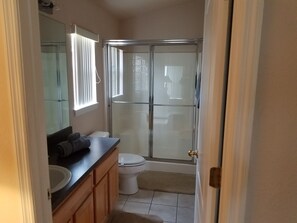 Combined shower/tub, hair dryer, towels, soap