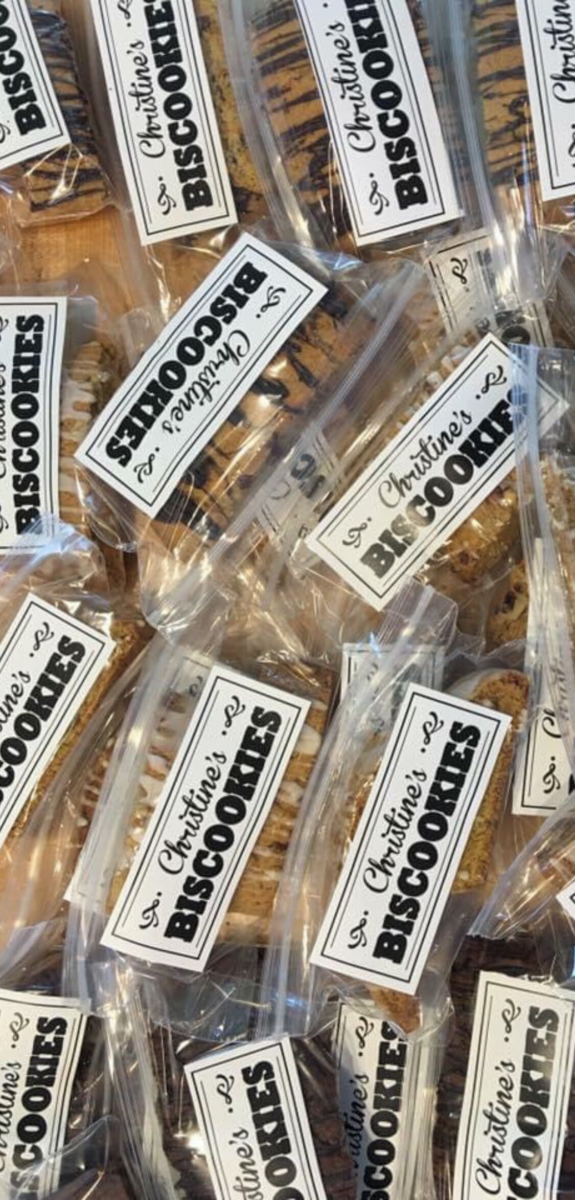 Varios paquetes de galletas etiquetados como "Christine's Biscuits".