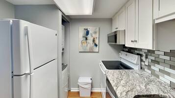 Condo, 1 King Bed with Sofa bed, Balcony, Garden View (Forest Beach Villa 306 - No Pets Allowed) | Private kitchen | Fridge, microwave, oven, stovetop