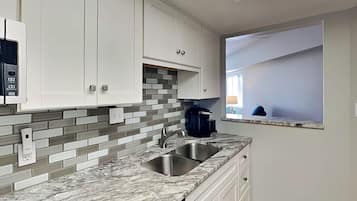 Condo, 1 King Bed with Sofa bed, Balcony, Garden View (Forest Beach Villa 306 - No Pets Allowed) | Private kitchen | Fridge, microwave, oven, stovetop