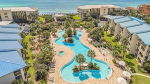 A resort with a winding pool, beachfront views, and multiple buildings with balconies. - High Pointe Overlooking Lagoon Pool, Gulf Views! (Rosemary Beach)