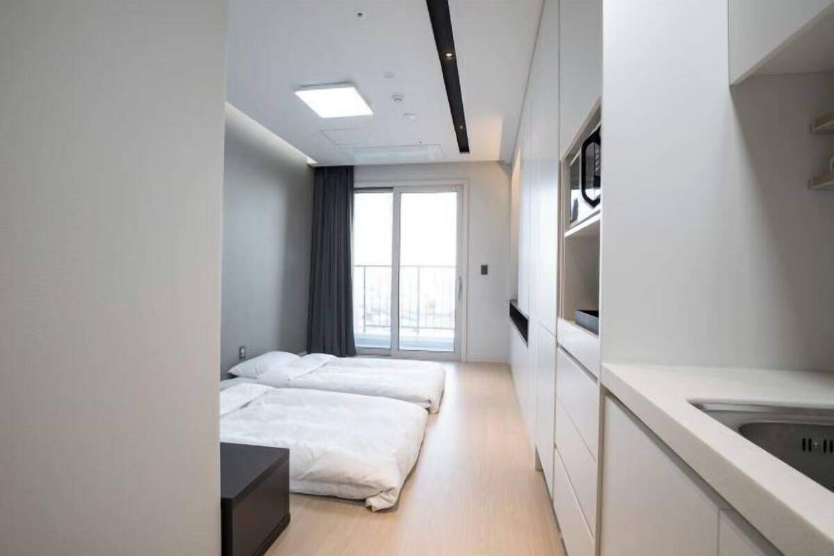 Premium bedding, down duvets, blackout curtains, soundproofing