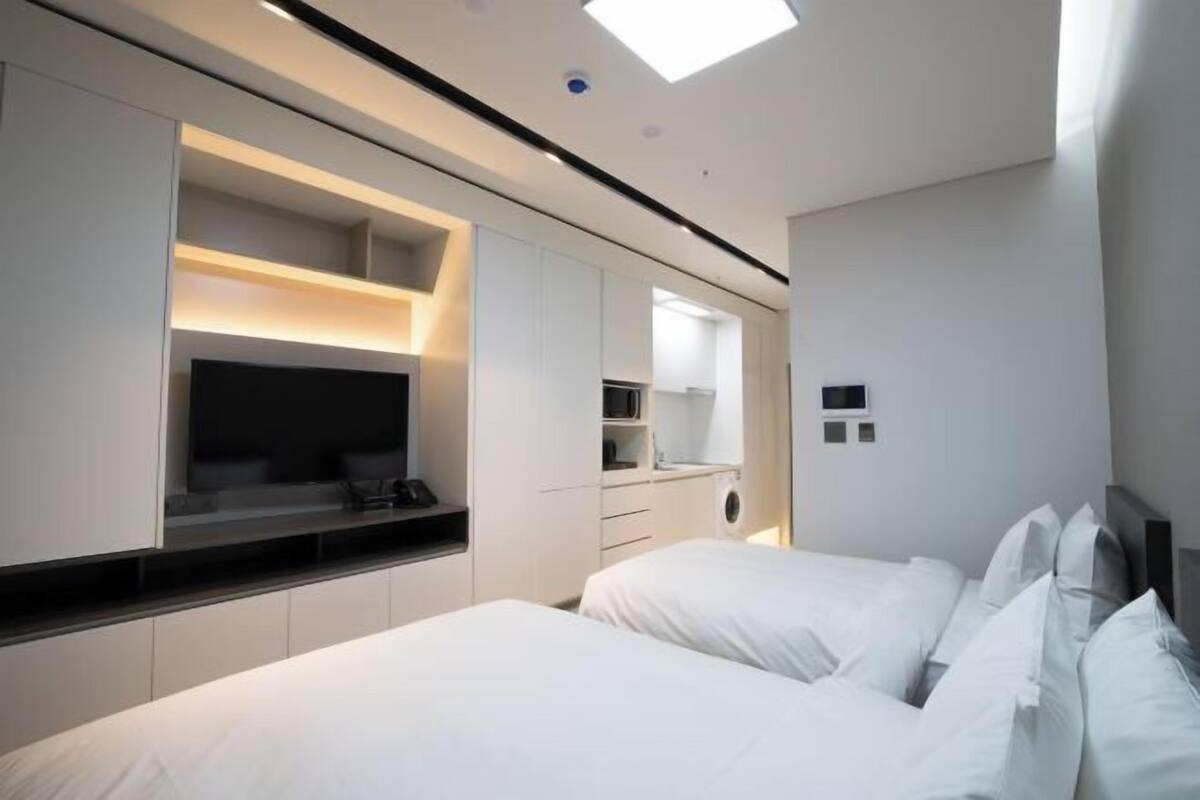 Premium bedding, down duvets, blackout curtains, soundproofing