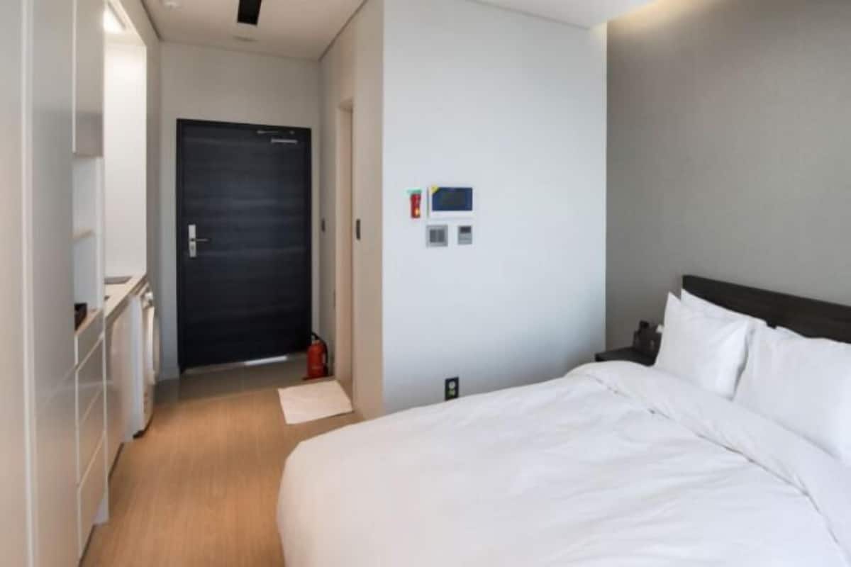 Premium bedding, down comforters, blackout drapes, soundproofing