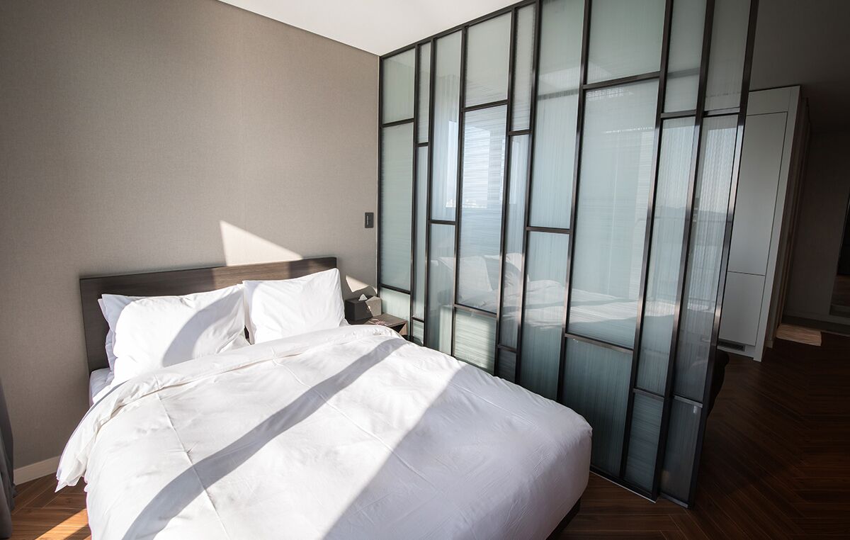 Premium bedding, down comforters, blackout drapes, soundproofing