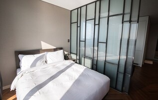 Premium bedding, down comforters, blackout drapes, soundproofing