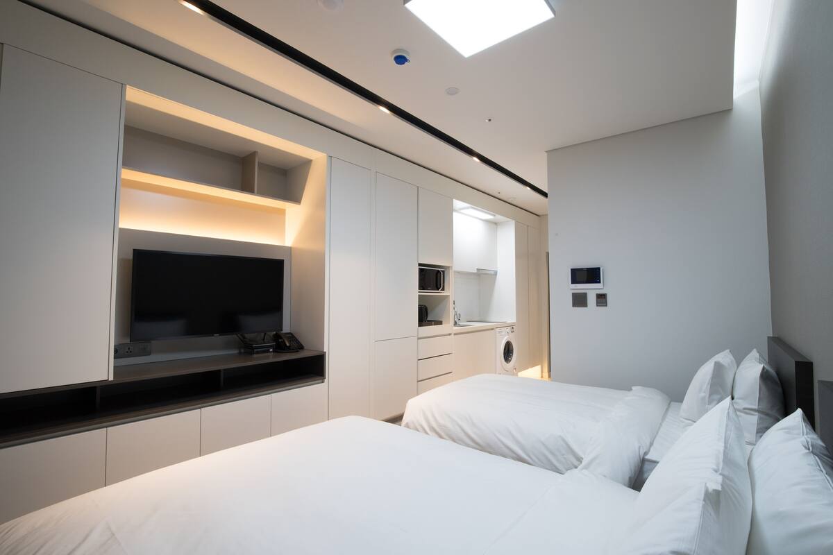 Premium bedding, down duvets, blackout curtains, soundproofing