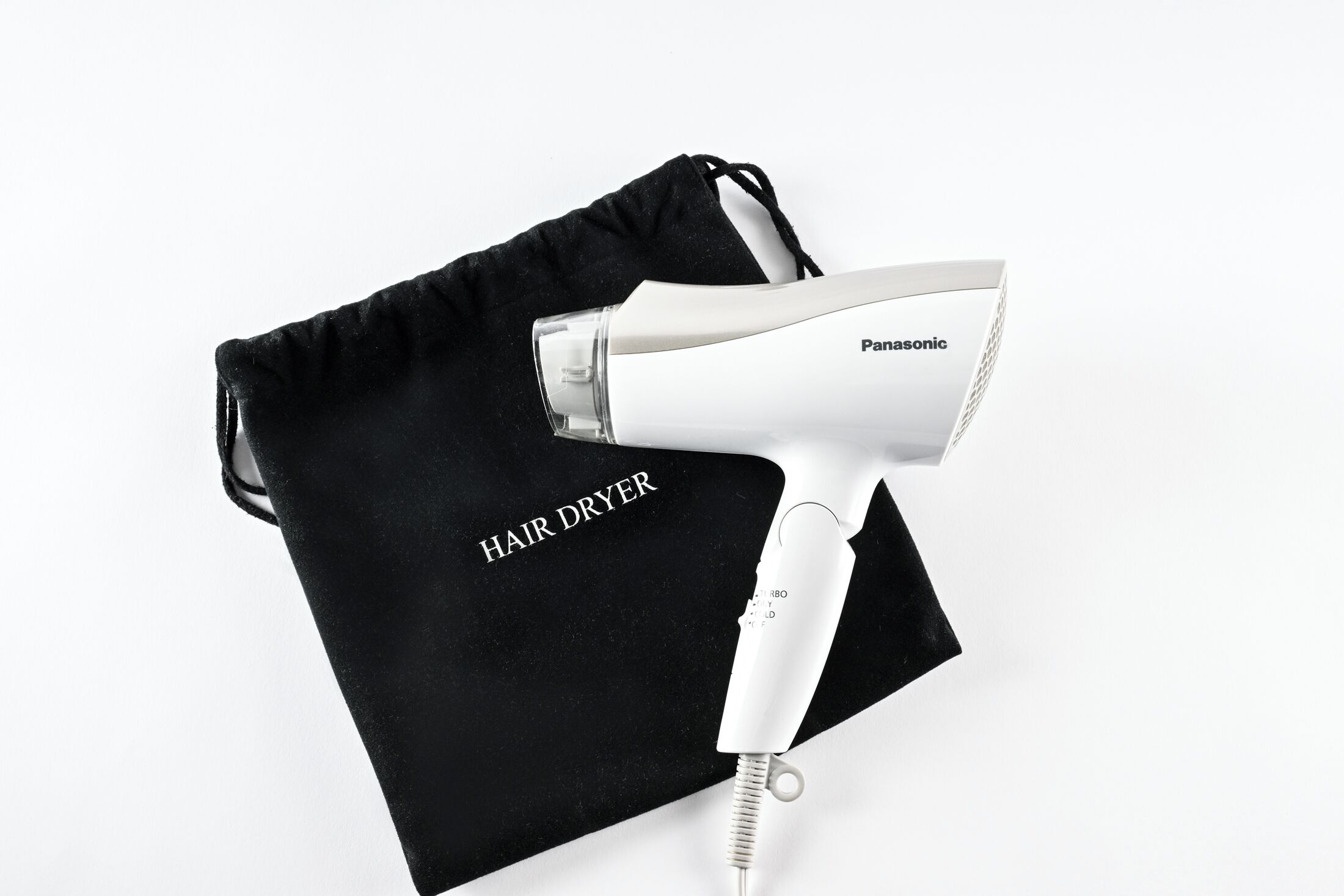 A Panasonic hair dryer with a black bag labeled 'HAIR DRYER' on a white background.