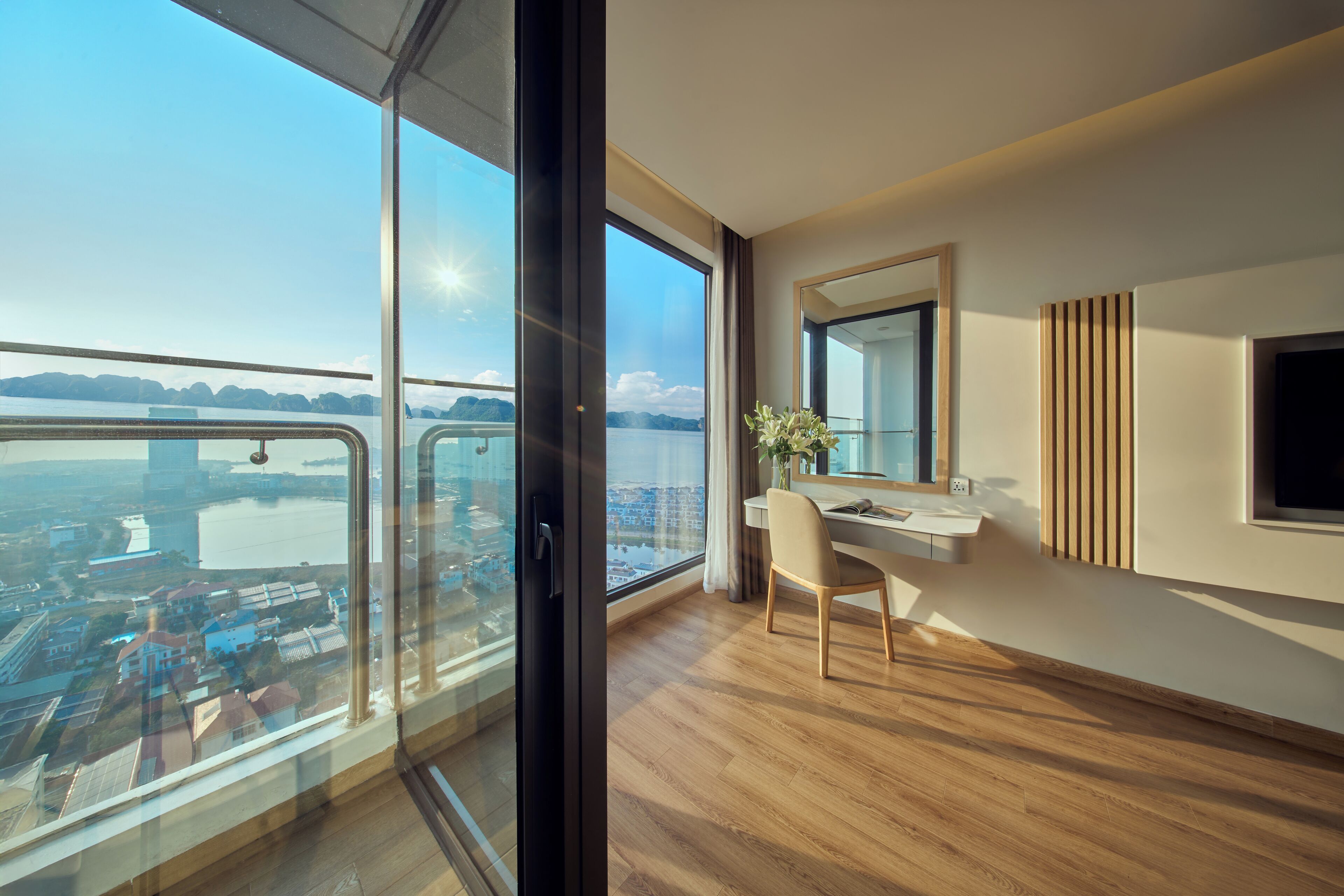 A modern room with a large window, a desk, and a chair.