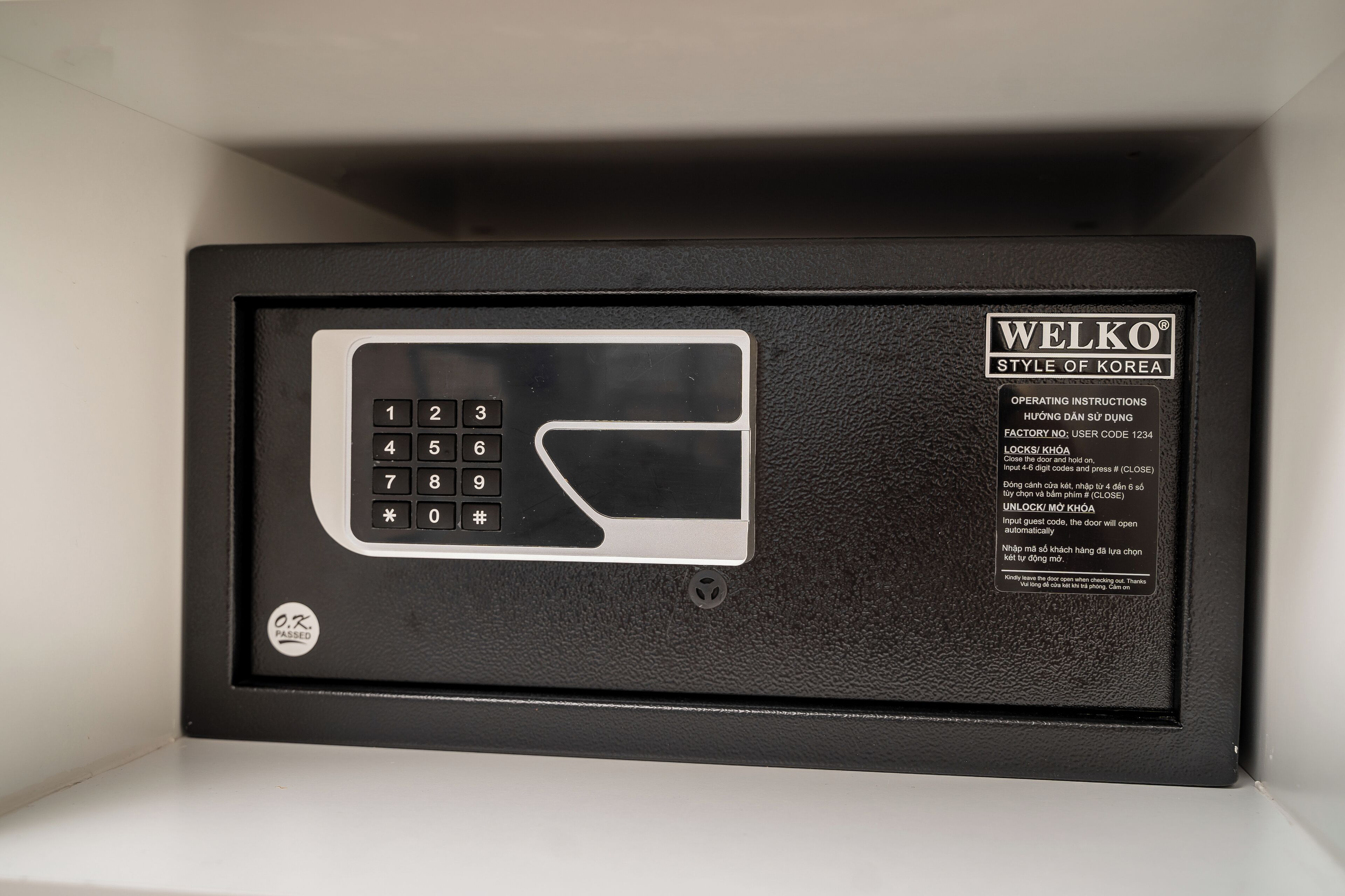 A black security keypad with instructions and a lock symbol.