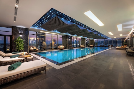 Indoor pool, open 6:00 AM to 8:00 PM, pool loungers. DeLaSea Ha Long Hotel