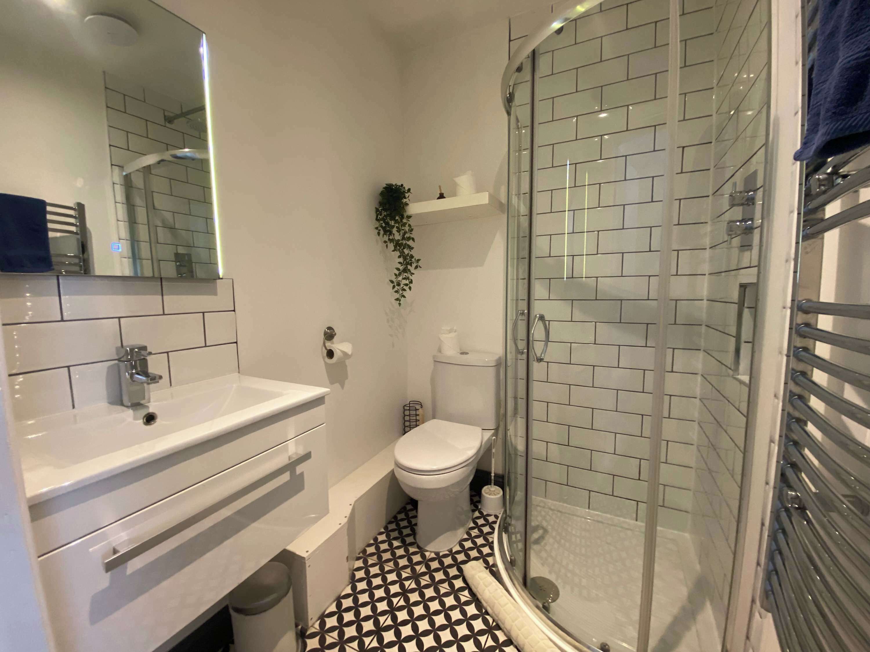 Shower, hair dryer, towels, shampoo