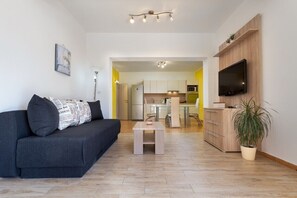Apartment (A4) | Living area | Flat-screen TV
