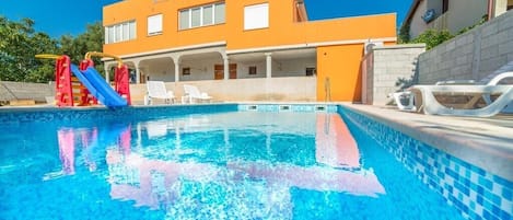 Seasonal outdoor pool, pool umbrellas, pool loungers