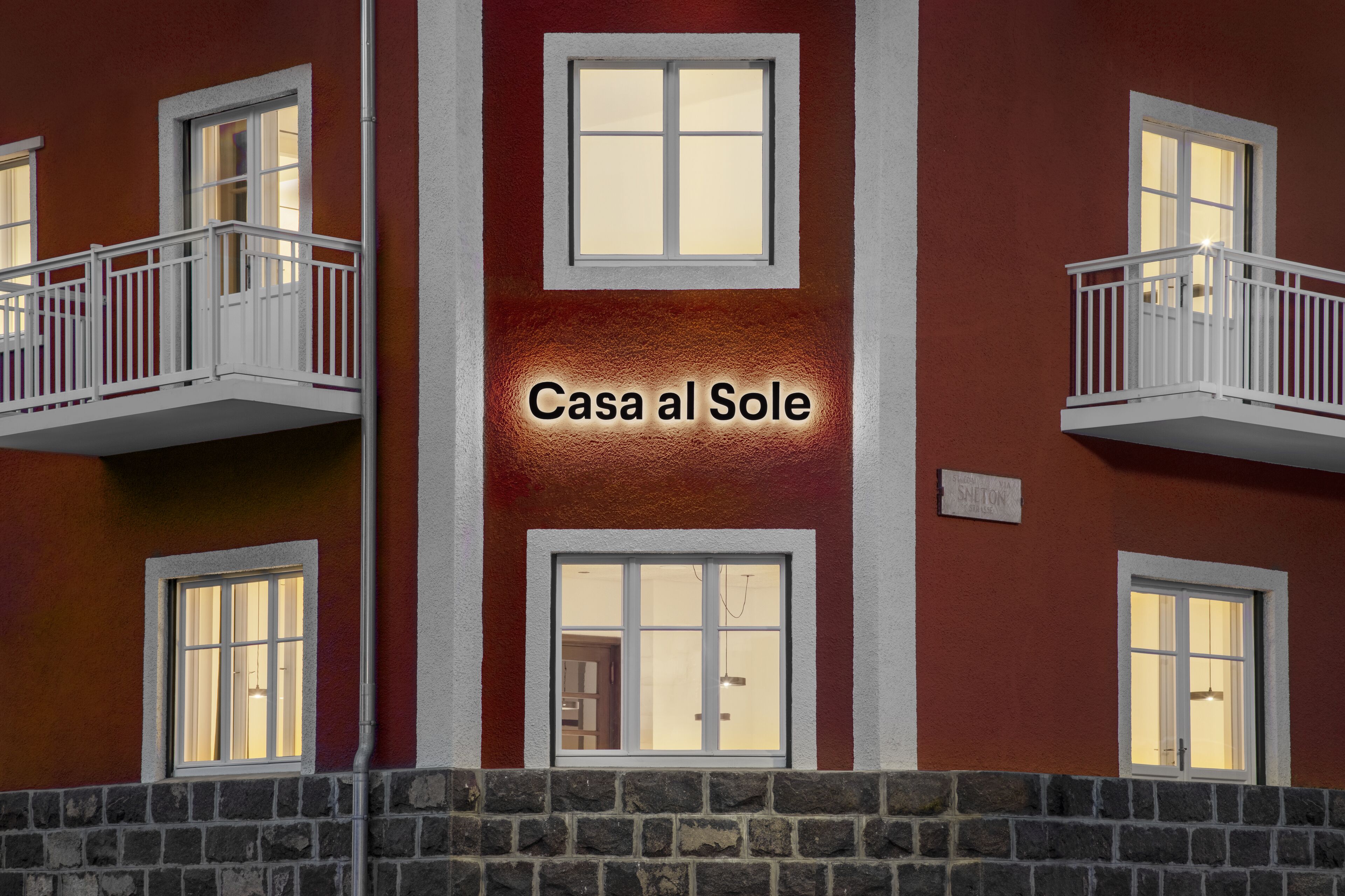 A building with balconies and windows, labeled "Casa al Sole."