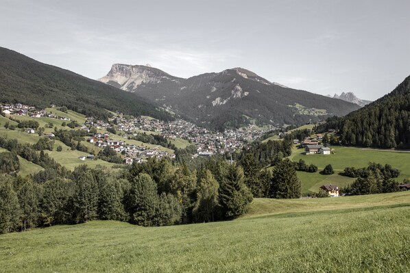 A mountainous landscape with a small town nestled in the valley.