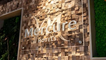 A wooden wall with the text "Mercure Hotels" indicating the name of the hotel.