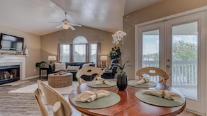 Enjoy meals with family and friends in this spacious dining area, featuring a large dining table and comfortable seating.