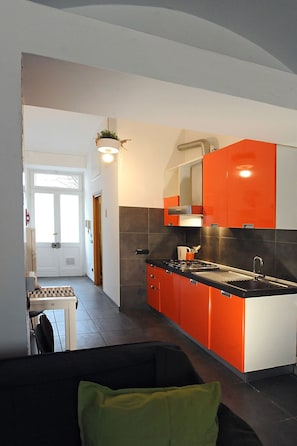 Fridge, microwave, electric kettle, cookware/dishes/utensils