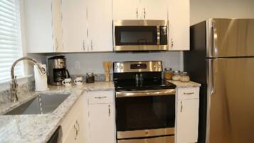 Fridge, microwave, dishwasher, coffee/tea maker