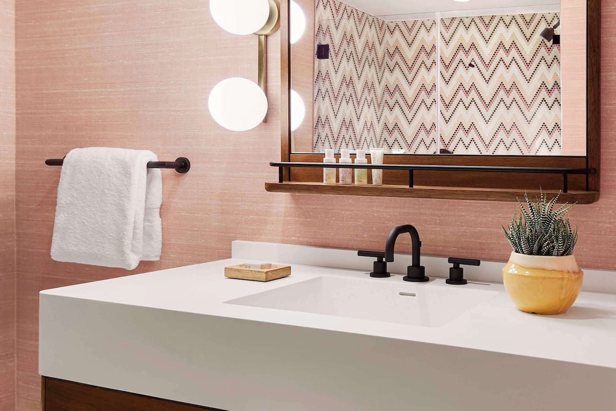 Combined shower/bathtub, designer toiletries, hair dryer, towels