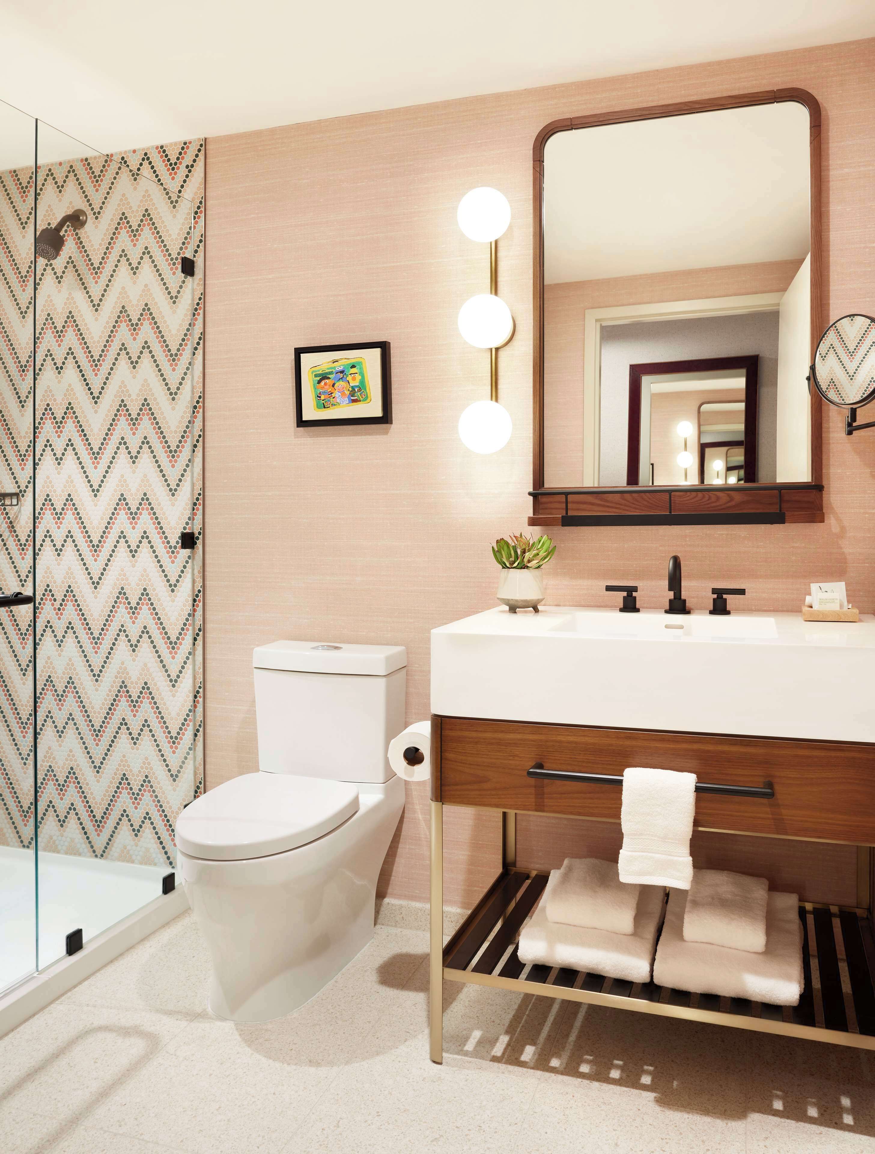 combined shower/bathtub, designer toiletries, hair dryer, towels