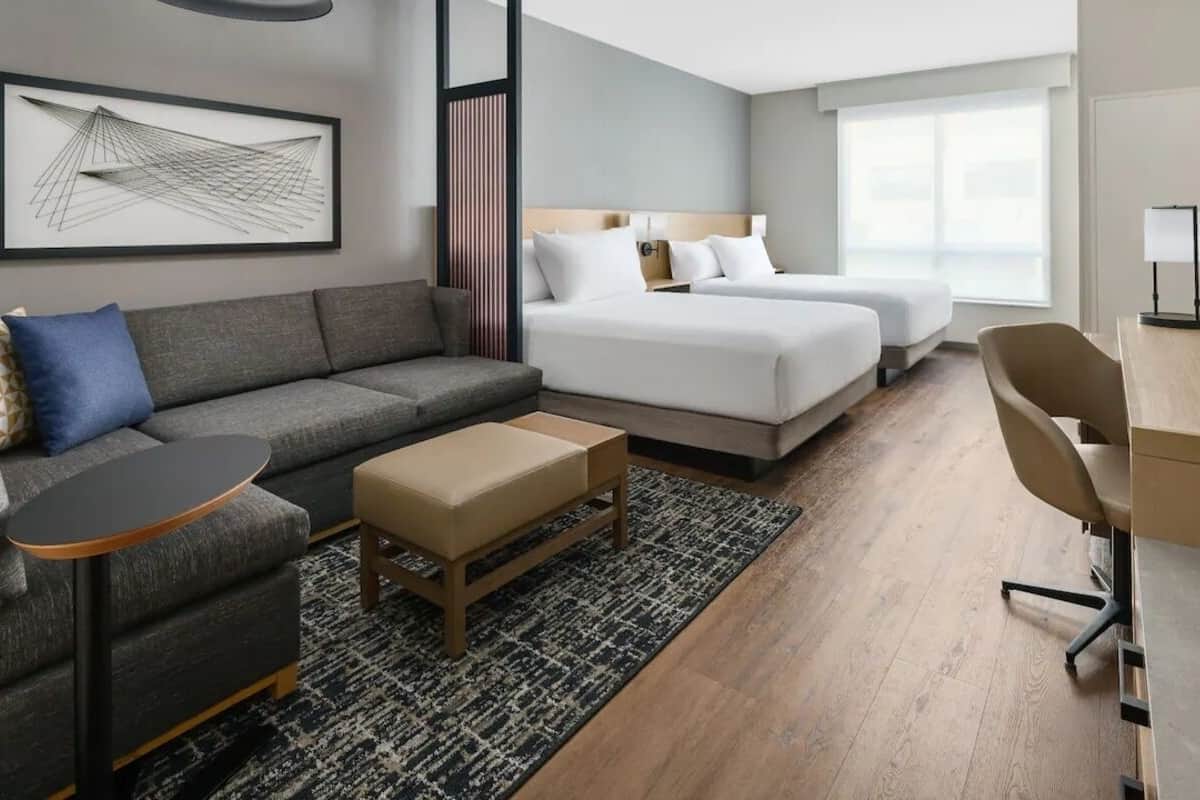 Premium bedding, pillow-top beds, desk, laptop workspace