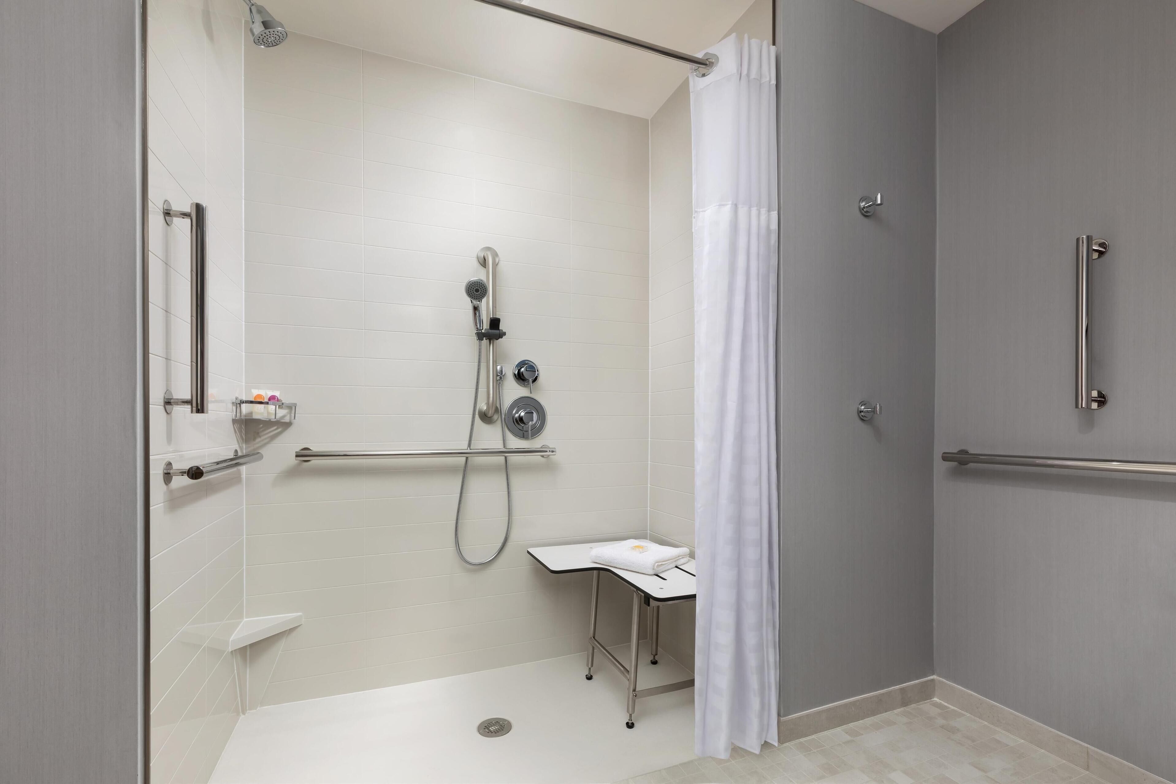 designer toiletries, hair dryer, towels