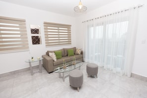 Appartement Confort | Salle de séjour | Télévision