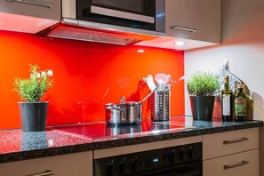 Enjoy cooking in this well-equipped kitchen with an oven, microwave, and ample counter space.