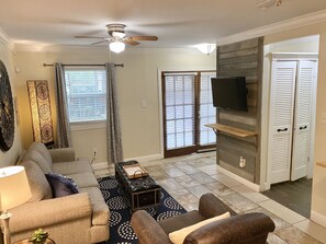 A beautiful lounging area that features a smart tv and open floor plan 